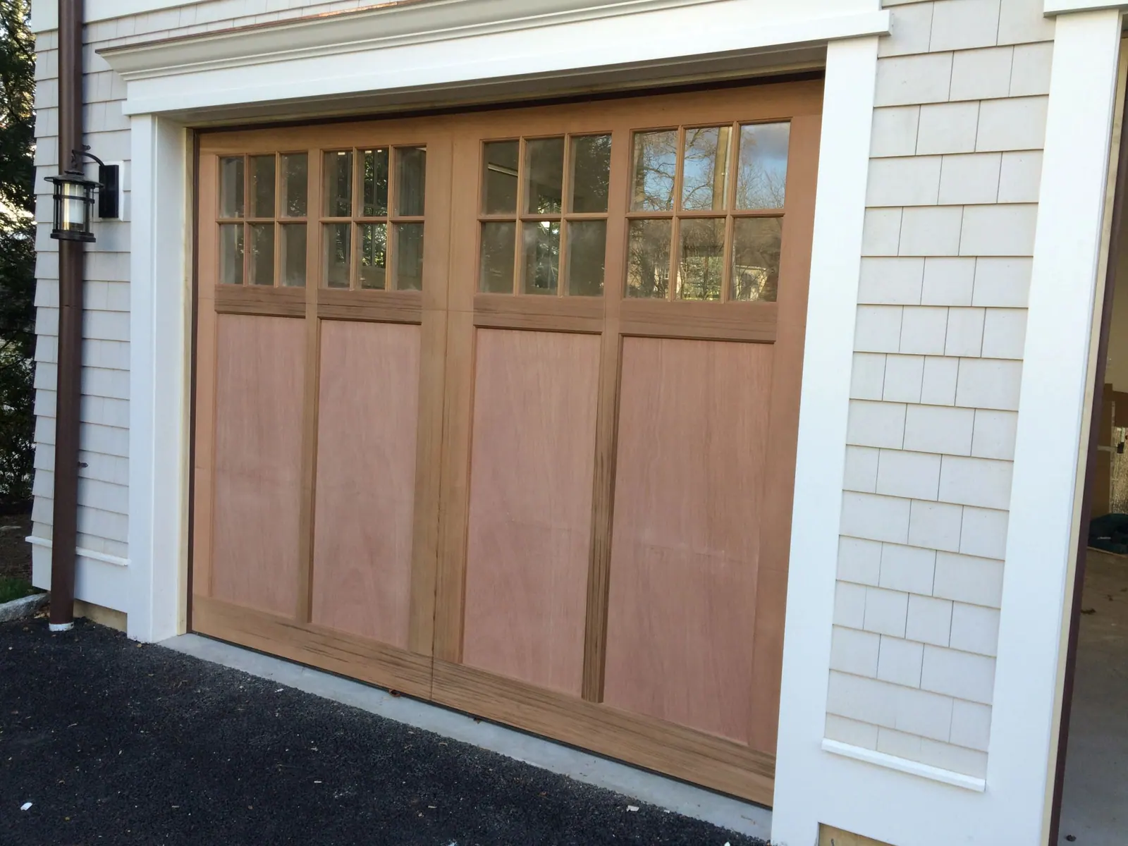 A stained cedar carriage door on an older Port Chester home
