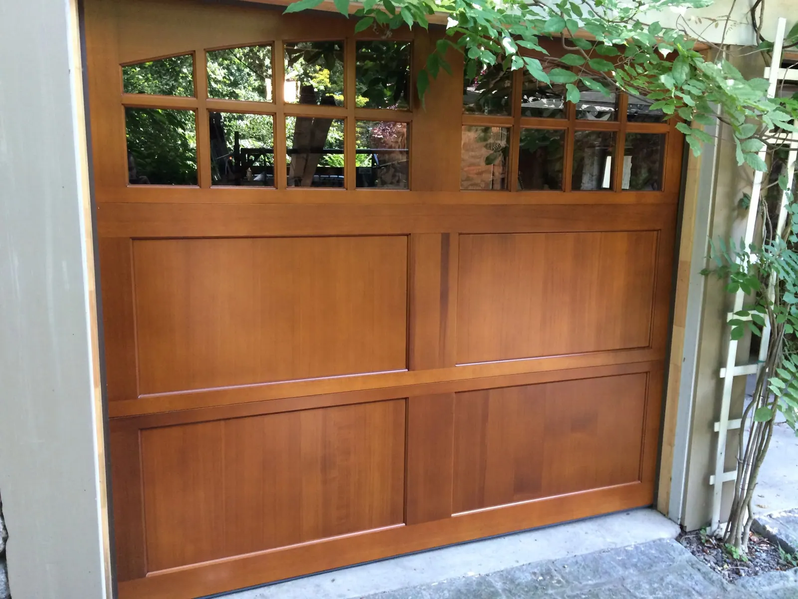 A cedar-wood carriage door on a Larchmont Manor home